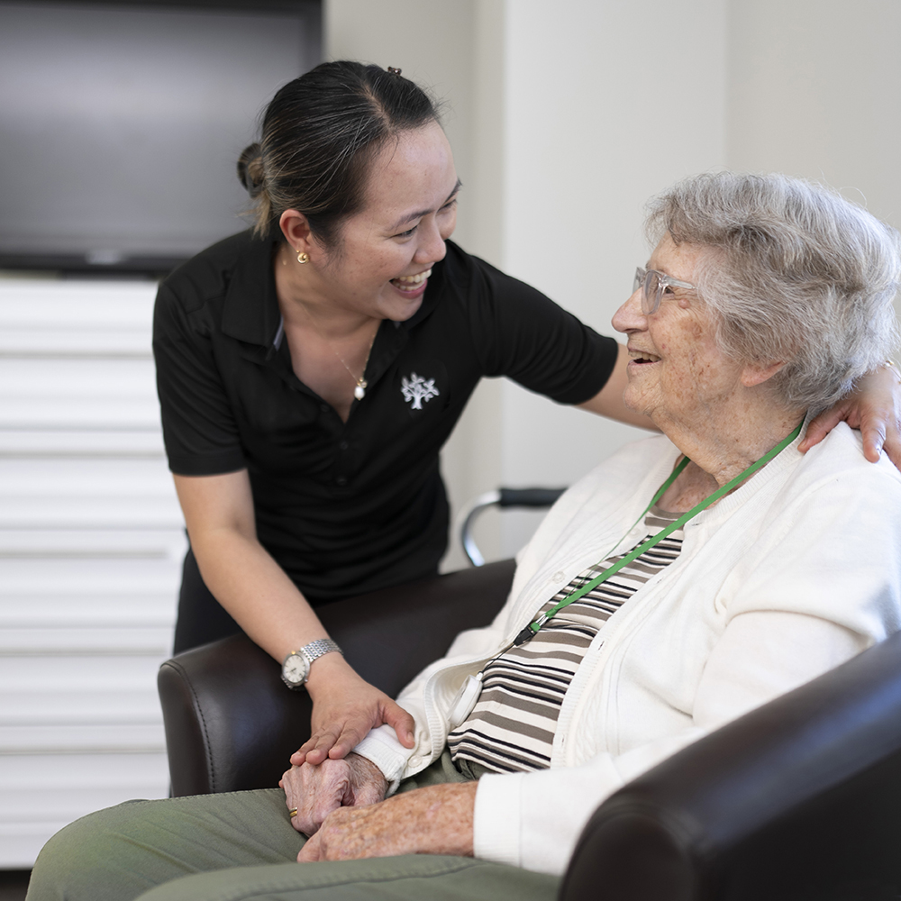 Team member sharing a warm moment with a resident at Atrium Retirement Residence in Orillia, reflecting the caring and supportive workplace culture.